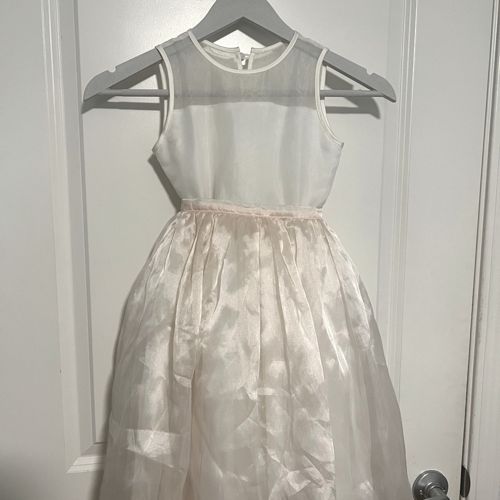 Flower girl dress with removable apron.